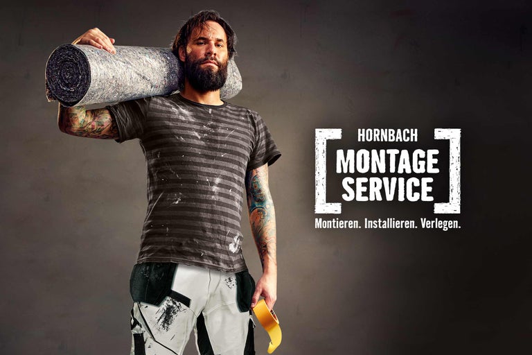 Handwerker mit Rolle Dämmmaterial und Klebeband, Hornbach Montageservice.