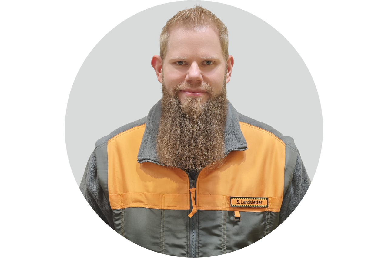 Porträt von S. Landstetter in Arbeitskleidung