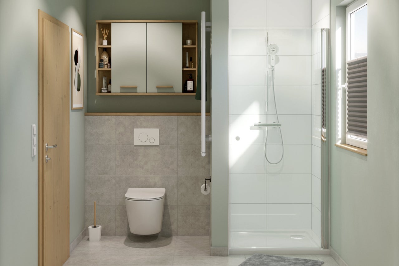 Badezimmer mit Dusche, Toilette, Spiegelschrank und Waschtisch