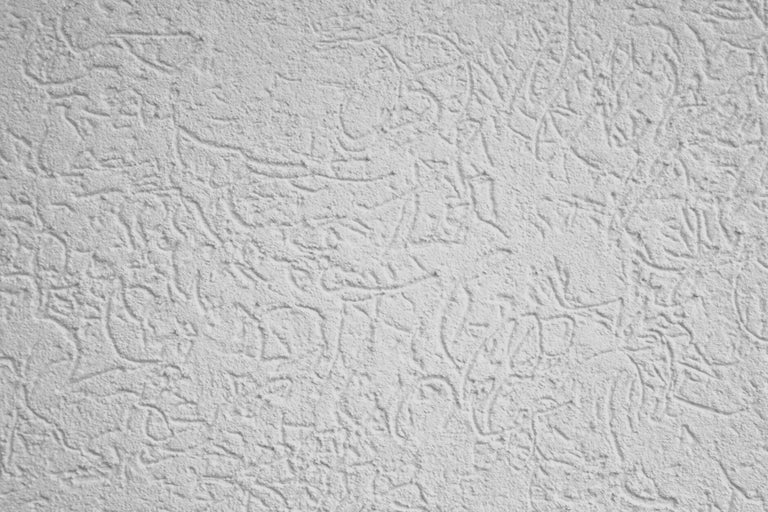 Nahaufnahme einer Wand mit Kratzputzstruktur