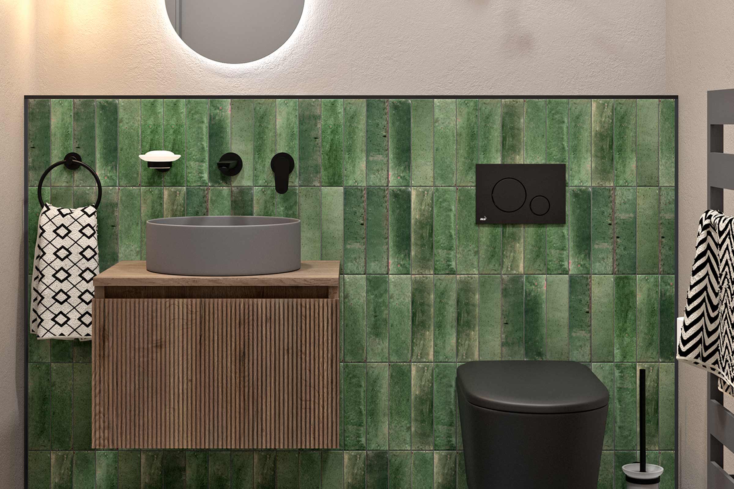 Modernes Badezimmer mit Waschtisch, Toilette und grünen Fliesen