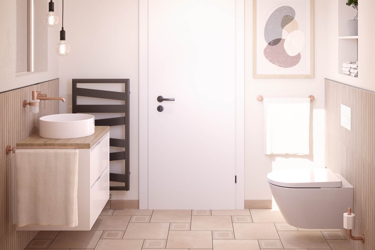 Helles Badezimmer mit Waschtisch, Handtuchwärmer und wandhängendem WC für ein freundliches Ambiente.