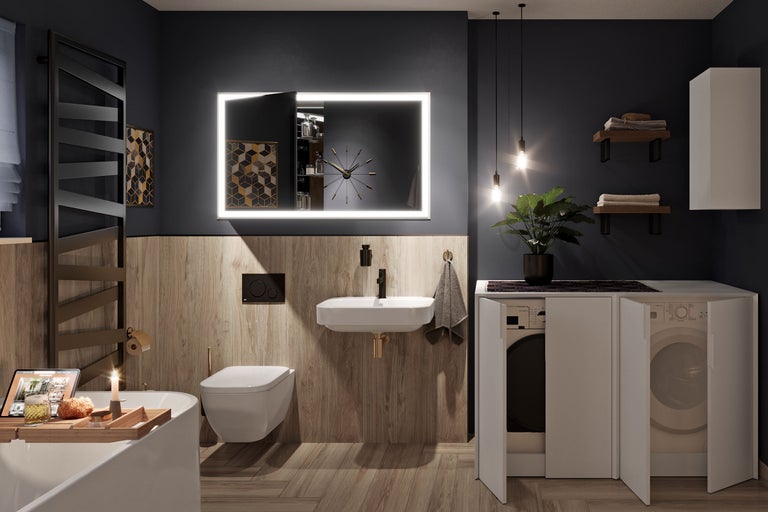 Modernes Badezimmer mit Badewanne, Waschtisch, Toilette, beleuchtetem Spiegel und Waschmaschine