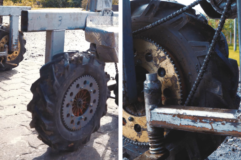 Detailaufnahme eines landwirtschaftlichen Reifens mit Kette und Metallrahmen