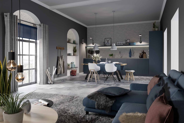 Wohnraum mit Sofa, Esstisch und Küchenzeile in modernem Design.