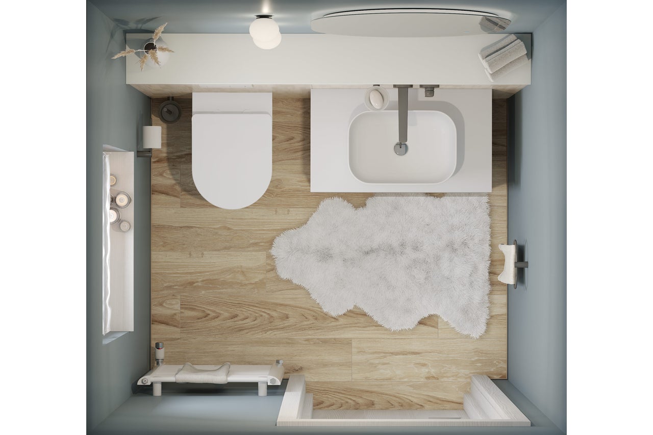 Draufsicht eines Badezimmers mit Toilette, Waschbecken, Badewanne und Badteppich