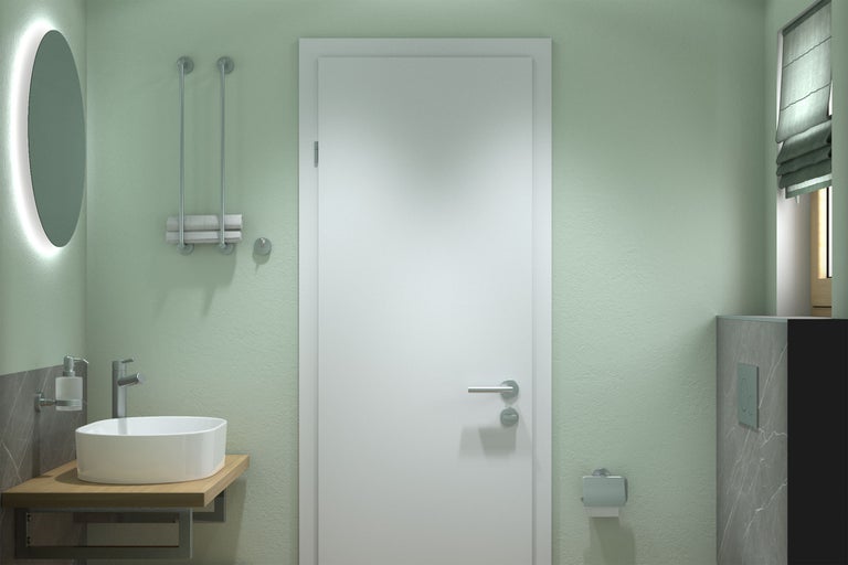 Modernes Badezimmer mit hellgrünen Wänden, weißer Innentür, rundem Aufsatzbecken auf Holzkonsole, Leuchtspiegel und Badaccessoires.