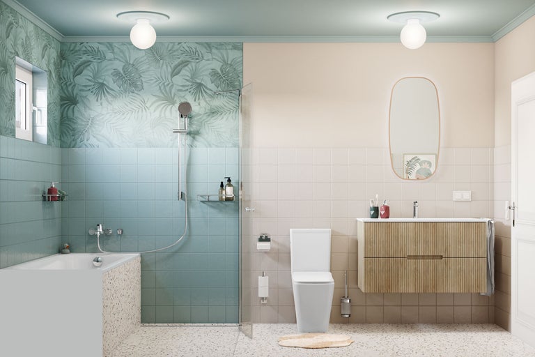 Modernes, helles Badezimmer mit blauen und beigen Fliesen, Badewanne in Terrazzo-Optik, begehbarer Dusche, weißem WC und Holzwaschtisch mit Spiegel.