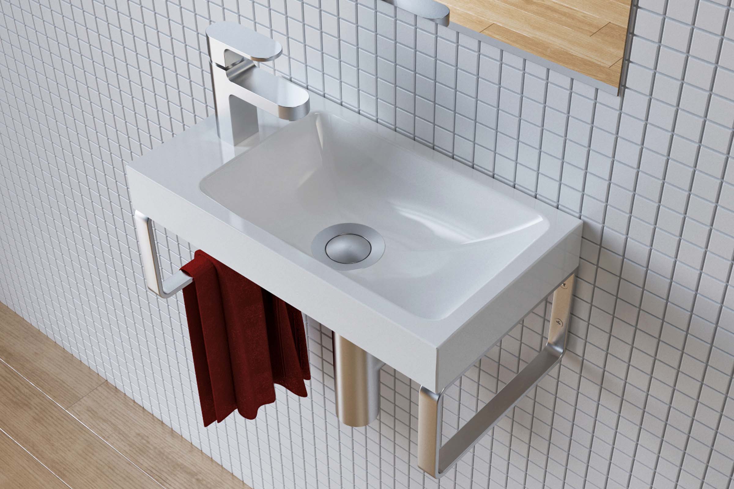 Waschtisch mit Armatur, Handtuch und Handtuchhalter im Badezimmer