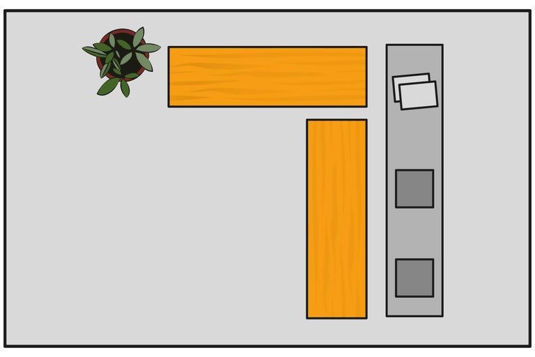 Draufsicht auf ein Eckbüro mit Pflanze, Schreibtischplatten und Rollcontainer