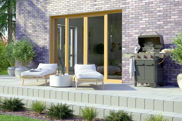 Terrasse mit Gartenmöbeln und Grill
