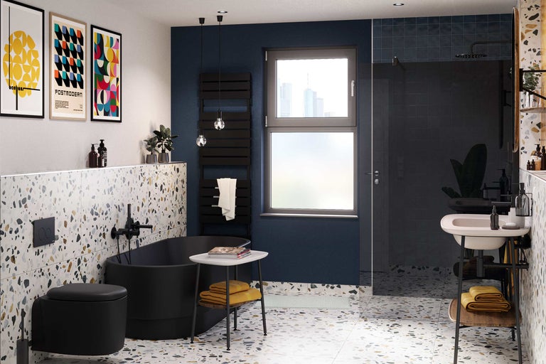 Modernes Badezimmer mit freistehender Badewanne, Toilette, Waschbecken und Terrazzoboden