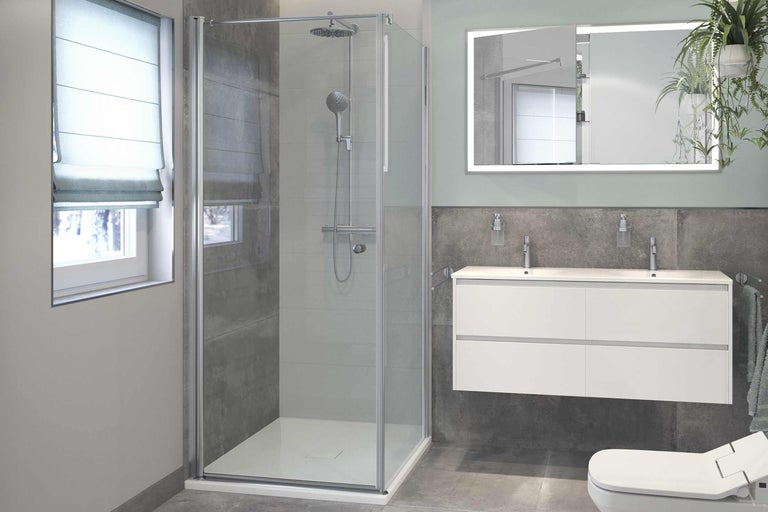 Modernes Badezimmer mit Duschkabine, Waschtisch und beleuchtetem Spiegel