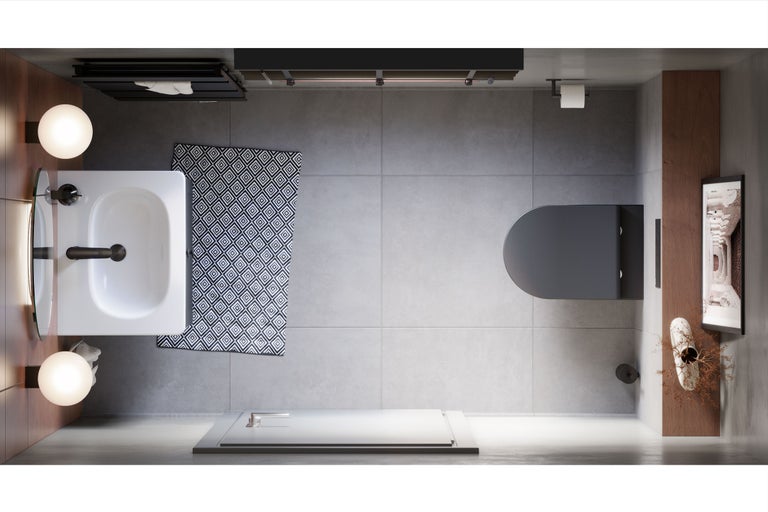 Vogelperspektive eines Badezimmers mit Waschbecken, Toilette, Duschwanne und Badezimmerteppich