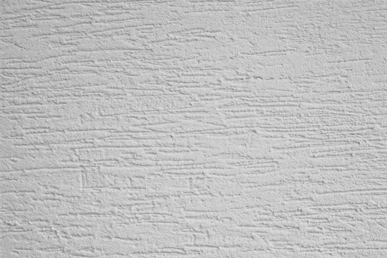 Nahaufnahme einer Wand mit Kratzputzstruktur