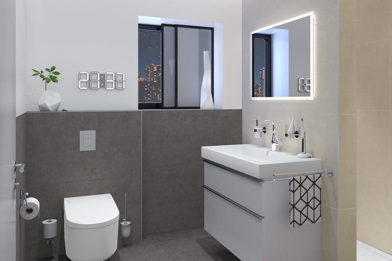 Modernes Badezimmer mit Waschtisch, Toilette und digitaler Uhr