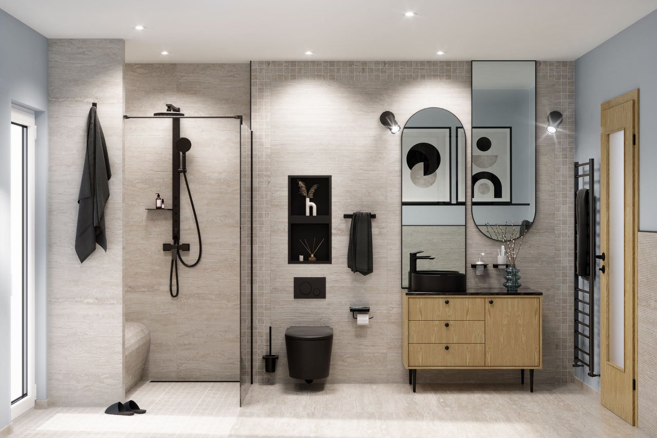 Modernes Badezimmer mit Dusche, Waschtisch, Spiegel und Toilette.