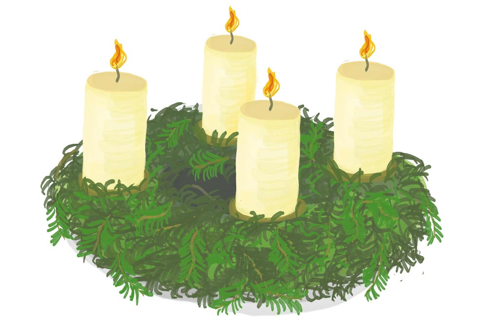 Adventskranz mit vier brennenden Kerzen