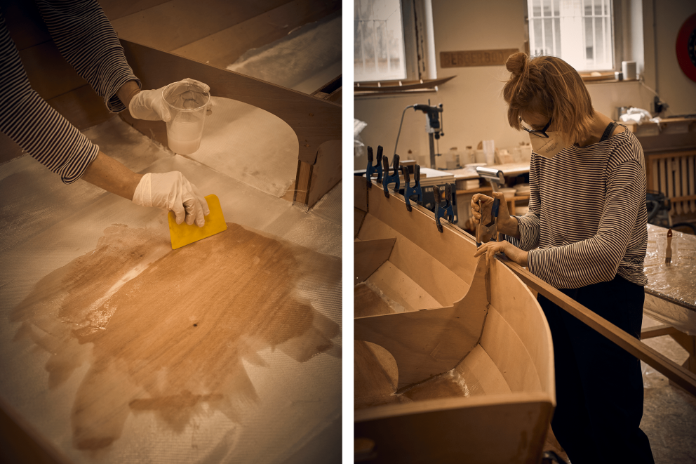 Mit der Spezialschere schneidet Bettina die Glasfaser und verstreicht die erste Epoxidschicht. Dann klammert sie die Außenleisten aus Mahagoni zum Verkleben fest. Mit der Spezialschere schneidet Bettina die Glasfaser und verstreicht die erste Epoxidschicht. Dann klammert sie die Außenleisten aus Mahagoni zum Verkleben fest.