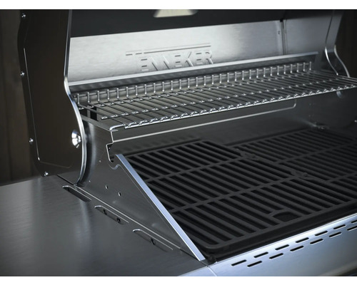 Innenansicht eines Edelstahlgrills mit Grillrost und Warmhalterost