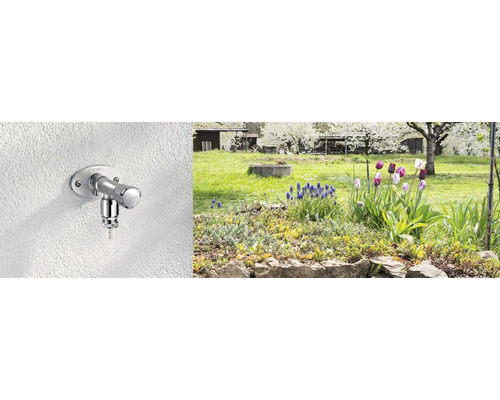Außenwasserhahn an einer Wand mit Garten im Hintergrund