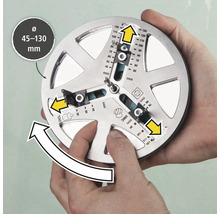 Ein Werkzeug zum genauen Anzeichnen von Bohrlöchern mit einem Durchmesser von 45 bis 130 Millimeter wird von zwei Händen gehalten.