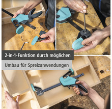 Wolfcraft Einhandzwinge mit 2 in 1 Funktion, Umbau von Zwingen auf Spreizen für Holzarbeiten an einer Holzkiste.