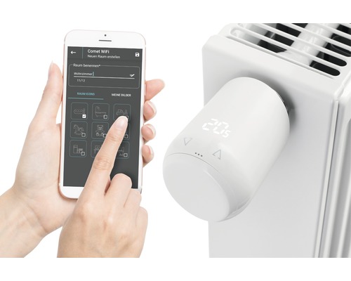 Intelligenter Heizkörperthermostat mit App-Steuerung am Heizkörper montiert und Smartphone zur Steuerung
