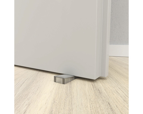 Türstopper unter einer Tür auf einem Holzboden