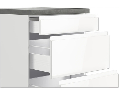 Weißer Unterschrank mit Schubladen und grauer Arbeitsplatte
