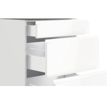 Weißer Schubladenschrank mit offenen Schubladen