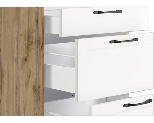 Schrank mit weißen Schubladen und schwarzen Griffen