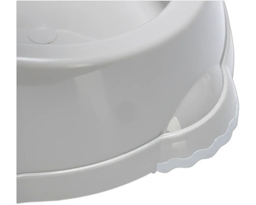 Detailansicht einer weißen, runden Hundetoilette aus Kunststoff