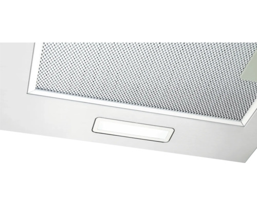 Ausschnitt einer Dunstabzugshaube mit Fettfilter und Beleuchtung