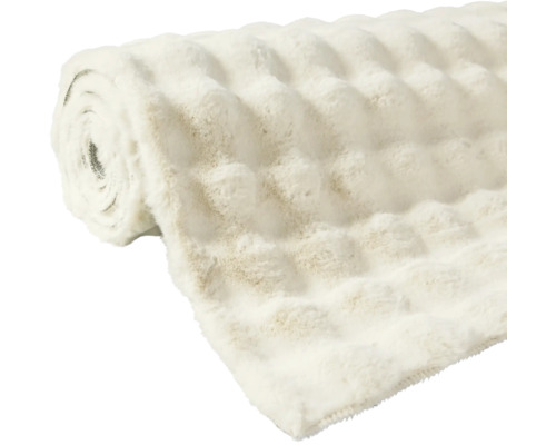 Gerollte Kuscheldecke mit Reliefstruktur