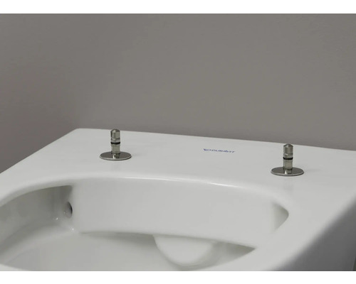 Detailansicht einer Toilette mit Toilettendeckel-Befestigung