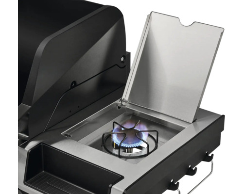 Detailansicht eines Gasgrills mit geöffnetem Seitenbrenner