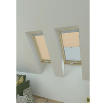 Zwei Dachfenster mit Rollos in einem hellen Raum