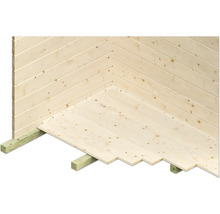 Detailansicht des Holzfußbodens und der Holzwand eines Gartenhauses.