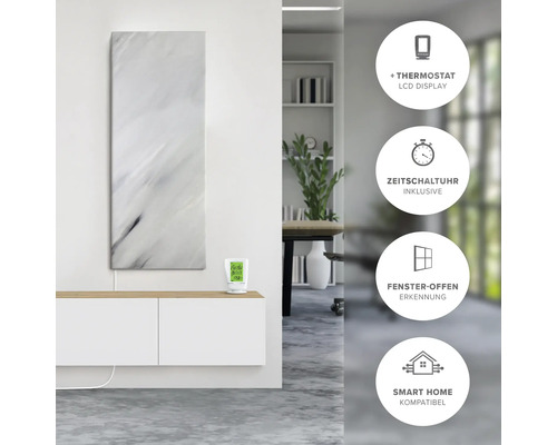 Infrarotheizung mit Marmoroptik und Thermostat auf einer Kommode