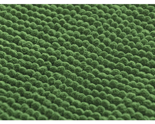 Nahaufnahme eines grünen Chenille-Teppichs