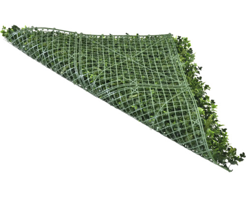 Kunsthecke mit grünen Blättern und Gitterstruktur