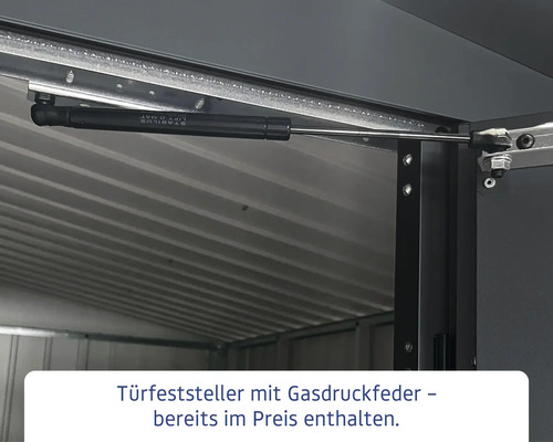 Detailaufnahme eines Türfeststellers mit Gasdruckfeder in einem Metallgerätehaus.