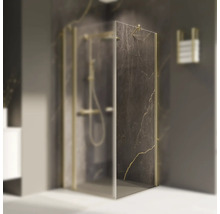 Eckdusche mit Marmorstruktur und goldenen Akzenten im Badezimmer.
