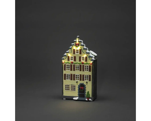 Beleuchtetes Weihnachtshaus als Dekoration