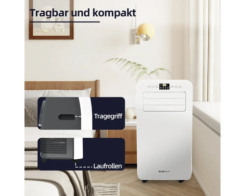 Weißes, mobiles Klimagerät im Schlafzimmer mit Tragegriff und Laufrollen.