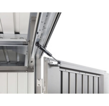 Detailaufnahme eines Gasdruckdämpfers an einem Metallobjekt