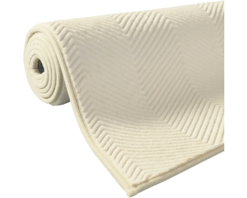 Aufgerollte Teppichunterlage mit Zickzackmuster