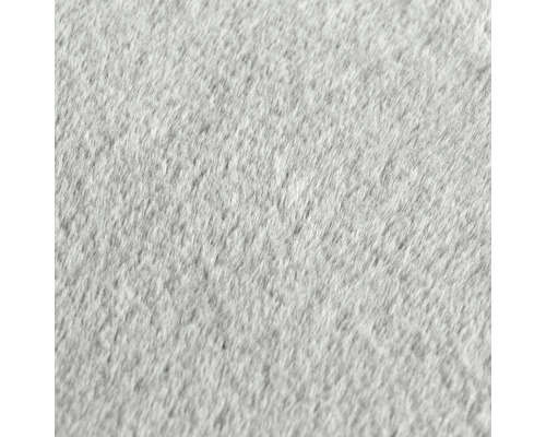 Nahaufnahme eines hellen Teppichs mit dichter Textur