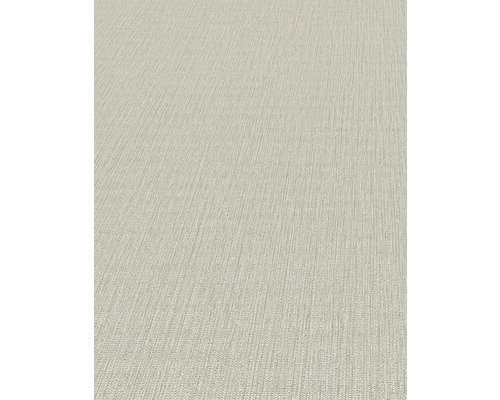 Detailansicht einer beigen Strukturtapete.